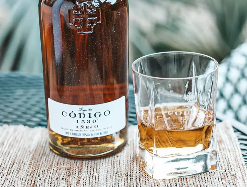 Codigo 1530 Anejo with tequila glass